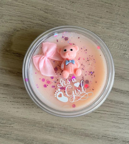 Pink baby shower candle with a bear figurine for baby girl