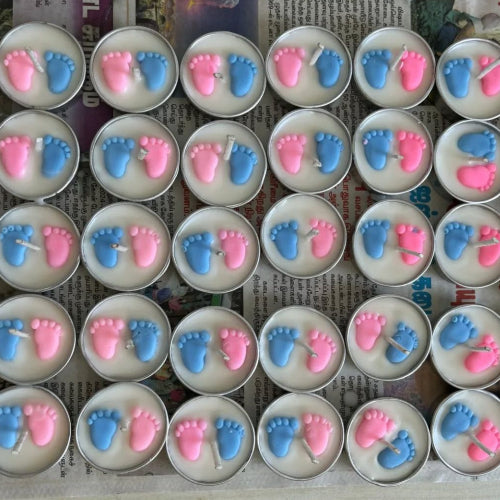 Blue and pink footprints candles for baby shower