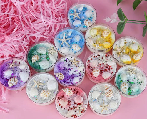 Assorted colorful jelly cups with starfish and seashell decorations.